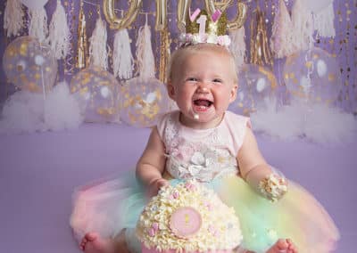 smiling little girl in cakesmash session
