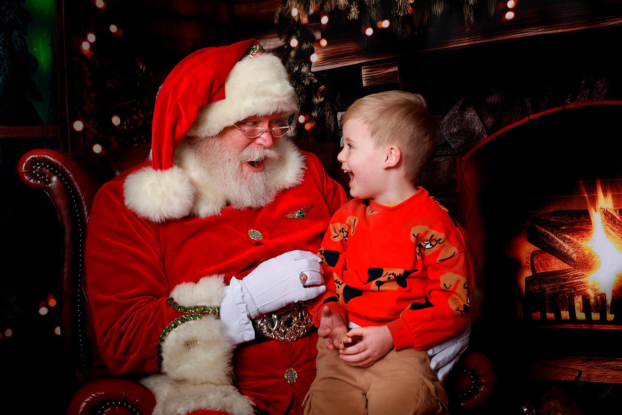 santa laughing with little boy