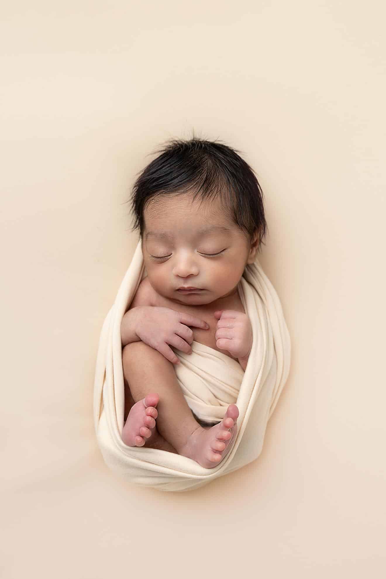 wrapped baby in newborn shoot